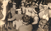 Hanukah in Tehila Kindergarten, Musrara, Varda Amos clapping hands in the center, 1957